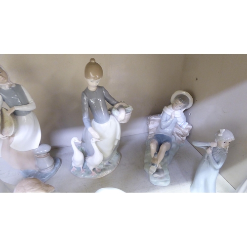 249 - Porcelain figures: to include a Lladro example, a young woman feeding geese  11