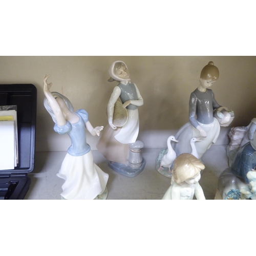 249 - Porcelain figures: to include a Lladro example, a young woman feeding geese  11