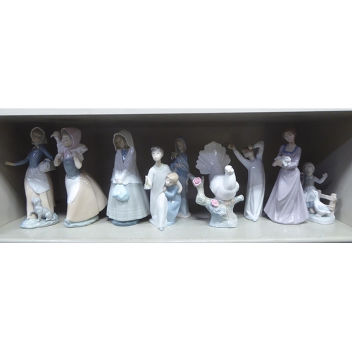 254 - Porcelain figures: to include a Lladro example, two children peering into the dark  8.5