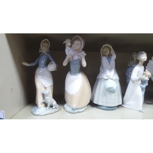 254 - Porcelain figures: to include a Lladro example, two children peering into the dark  8.5