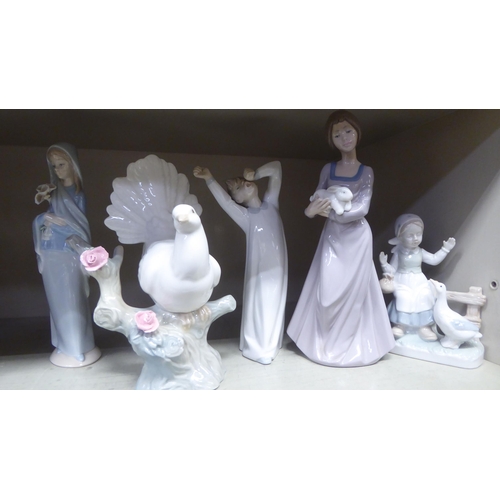 254 - Porcelain figures: to include a Lladro example, two children peering into the dark  8.5