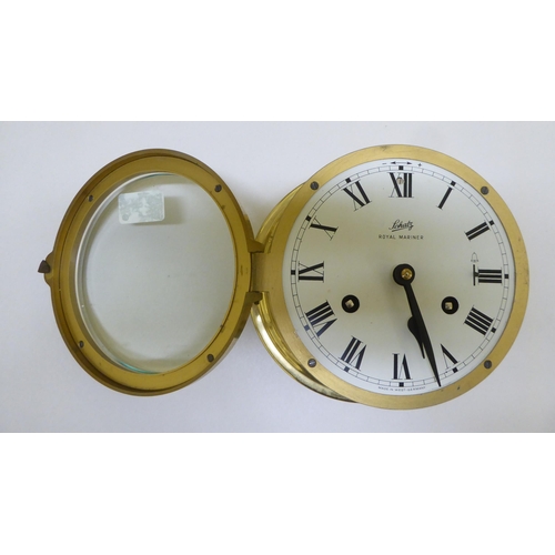 259 - A lacquered brass cased bulkhead 8 day timepiece; and similar barometer  each 7