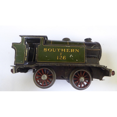 260 - Hornby 0 gauge tinplate clockwork model railway accessories: to include a 0-4-0 locomotive and tende... 