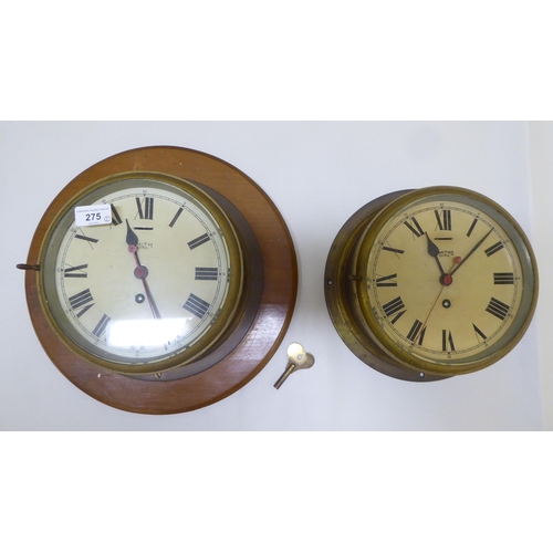 275 - Two Smiths Astral brass cased bulkhead timepieces with painted Roman dials, one mounted on a plaque ... 