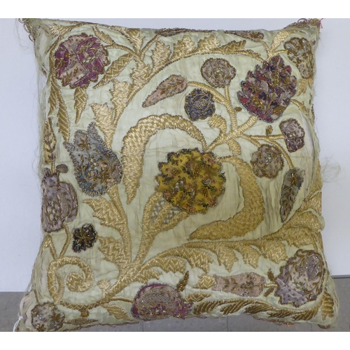 290 - A 20thC foliate patterned embroidered scatter cushion with coloured threads