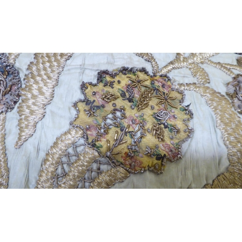 290 - A 20thC foliate patterned embroidered scatter cushion with coloured threads