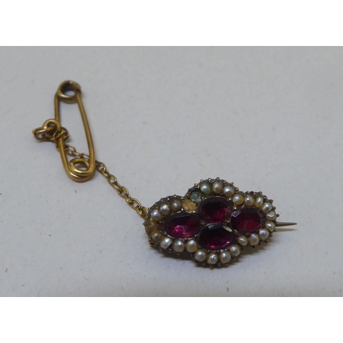 298 - Items of personal ornament: to include a hatpin; and a yellow metal ring 