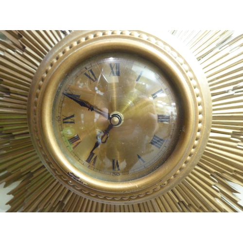 3 - A mid 20thC composition sunburst clock; the quartz movement faced by a Roman dial  19