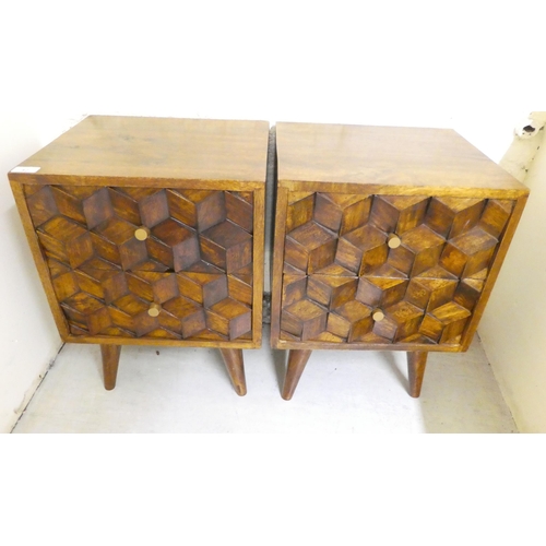 42 - A pair of modern hardwood two drawer bedside chests, raised on tapered legs  22