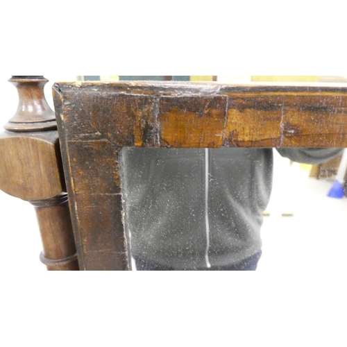 62 - A Regency mahogany toilet mirror, pivoting on turned horns, on a box base with three drawers  25