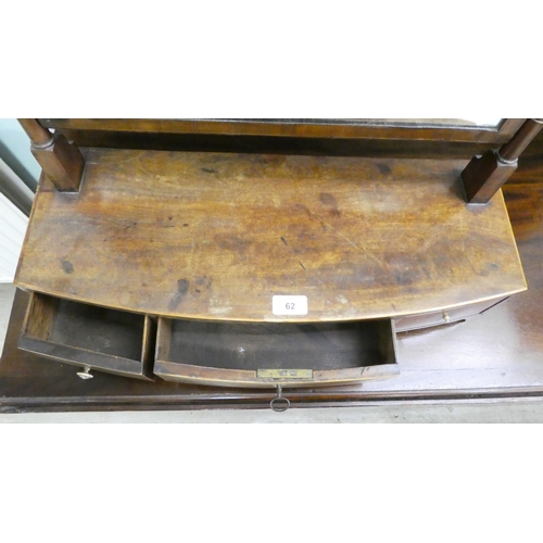 62 - A Regency mahogany toilet mirror, pivoting on turned horns, on a box base with three drawers  25