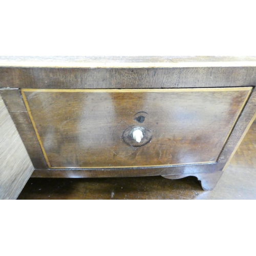 62 - A Regency mahogany toilet mirror, pivoting on turned horns, on a box base with three drawers  25