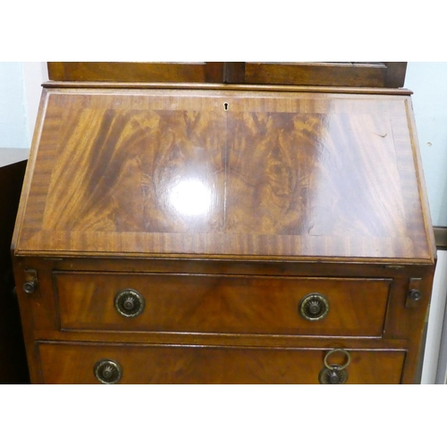 68 - A modern crossbanded mahogany bureau bookcase, raised on bracket feet&nbsp; 79
