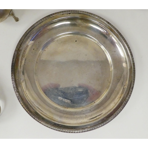 69 - Silver collectables: to include scent bottles; a spoon; and a shallow dish&nbsp; 6