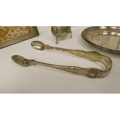 69 - Silver collectables: to include scent bottles; a spoon; and a shallow dish&nbsp; 6