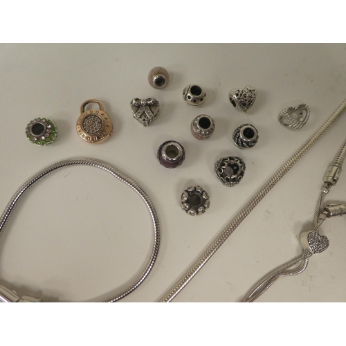 77 - A silver Pandora bracelet; and associated charms