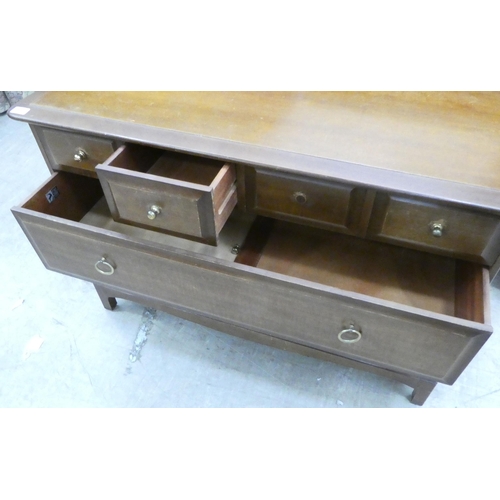 78 - A Stag mahogany six drawer dressing chest, raised on bracket feet&nbsp; 28