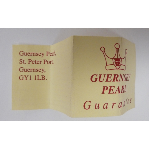 82 - Three ladies Guernsey gold plated and steel cased wristwatches, each pearl set   two boxed