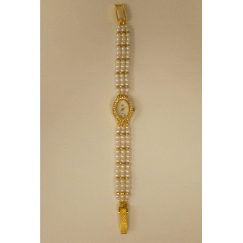 82 - Three ladies Guernsey gold plated and steel cased wristwatches, each pearl set   two boxed