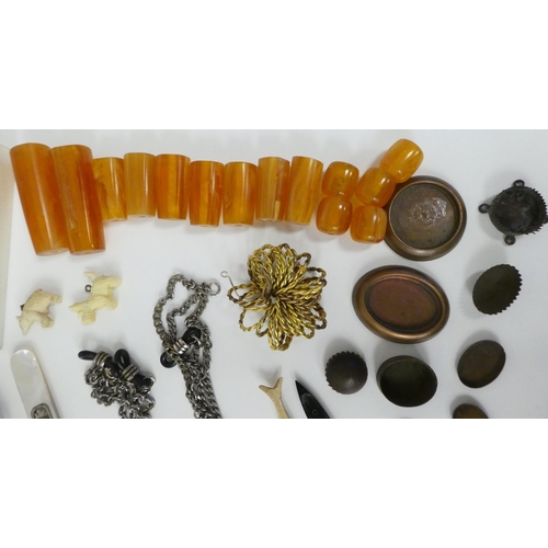 84 - Items of personal ornament: to include amber coloured loose stones; and bangles