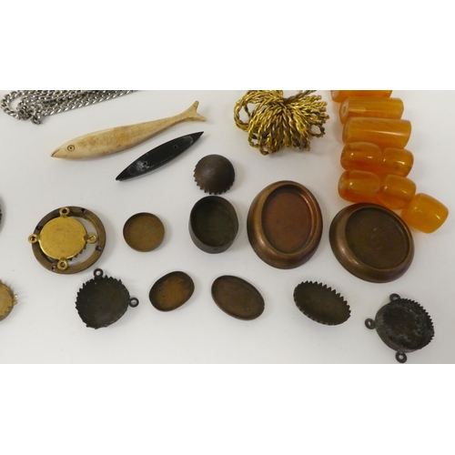 84 - Items of personal ornament: to include amber coloured loose stones; and bangles