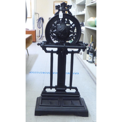 199 - A reproduction of a Victorian black painted cast iron stickstand  35