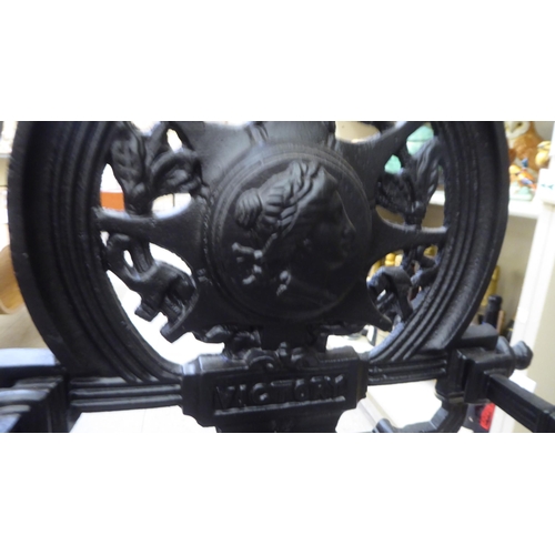 199 - A reproduction of a Victorian black painted cast iron stickstand  35