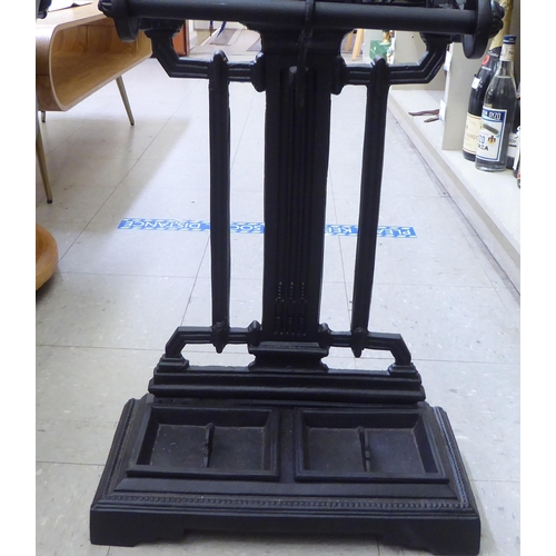 199 - A reproduction of a Victorian black painted cast iron stickstand  35