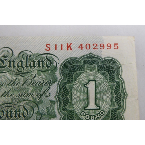 244 - A British £1 note, serial no.S11K402995 with production error on the corner