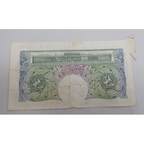 244 - A British £1 note, serial no.S11K402995 with production error on the corner