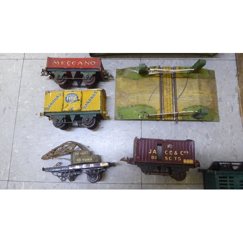 308 - Model railway related items by Hornby: to include track, tinplate buildings and rolling stock