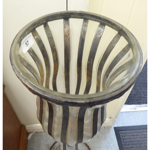 57 - A modern wrought metal framed candlestand with a glass bowl  32