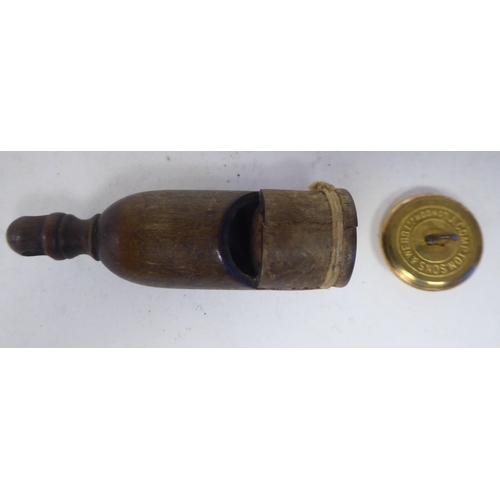 118 - A 19thC Great Western Railway guards wooden whistle with an impressed mark; and a later GWR Compton ... 