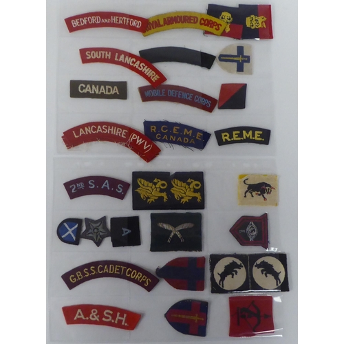 120 - A miscellaneous collection of military embroidered uniform badges and titles, some copies: to includ... 