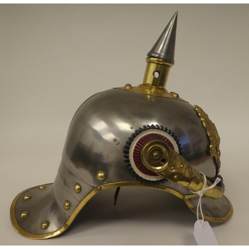 121 - A German polished steel and brass mounted pickelhaube with a liner(Please Note: this lot is subject ... 