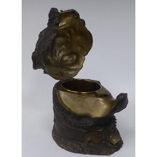 123 - An Austrian patinated bronze novelty desktop tobacco bowl, fashioned as a bulldog's head with a stud... 