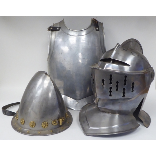 124 - Re-enactment armour, viz. a knight's helmet incorporating a visor; a breastplate with buckled straps... 