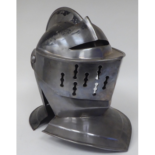 124 - Re-enactment armour, viz. a knight's helmet incorporating a visor; a breastplate with buckled straps... 