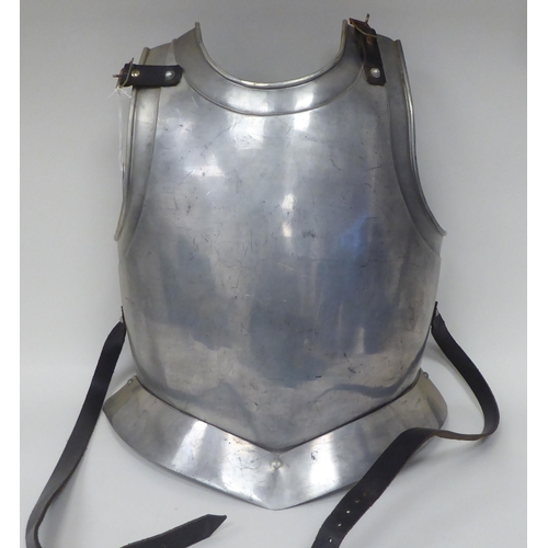 124 - Re-enactment armour, viz. a knight's helmet incorporating a visor; a breastplate with buckled straps... 