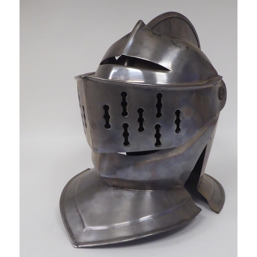 124 - Re-enactment armour, viz. a knight's helmet incorporating a visor; a breastplate with buckled straps... 