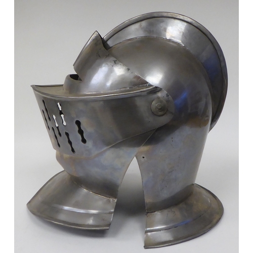 124 - Re-enactment armour, viz. a knight's helmet incorporating a visor; a breastplate with buckled straps... 