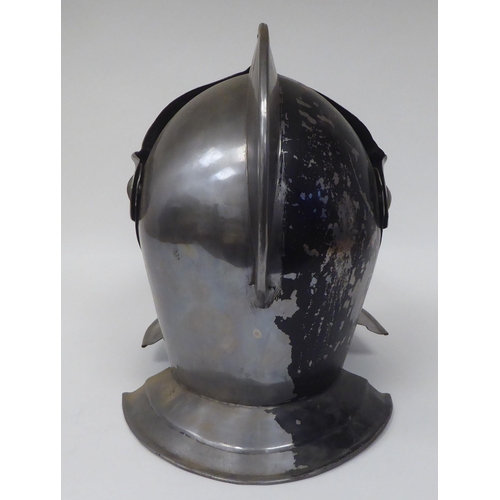 124 - Re-enactment armour, viz. a knight's helmet incorporating a visor; a breastplate with buckled straps... 