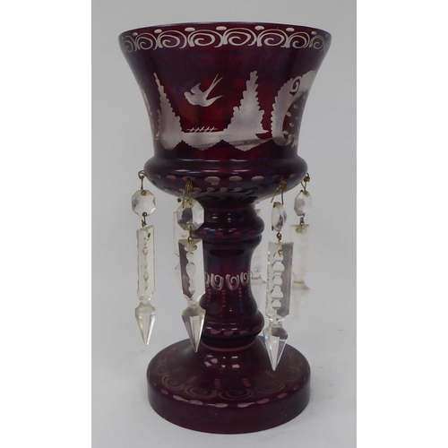 16 - A pair of late 19thC ruby coloured glass and engraved goblet design lustre vases, the bowls suspendi... 