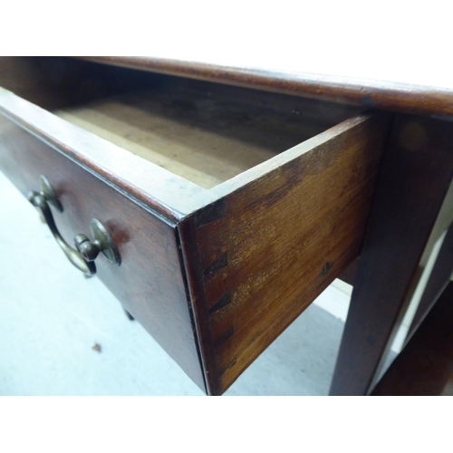 161 - An early 19thC mahogany side table, the overhanging top above a frieze drawer with twin brass bail h... 