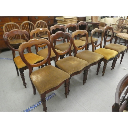 162 - A set of ten mid Victorian mahogany framed balloon back dining chairs, upholstered in sand coloured ... 