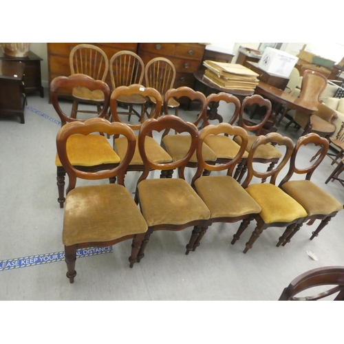 162 - A set of ten mid Victorian mahogany framed balloon back dining chairs, upholstered in sand coloured ... 