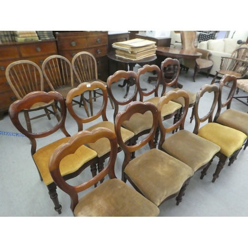 162 - A set of ten mid Victorian mahogany framed balloon back dining chairs, upholstered in sand coloured ... 