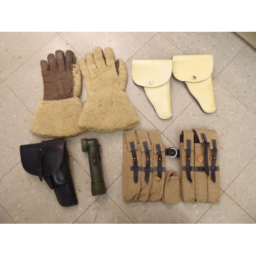 163 - Military and civil defence related equipment: to include stitched hide holsters and three similar ba... 