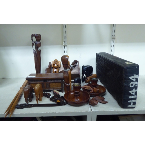 168 - Wooden items: to include carved animals; and a book trough  6