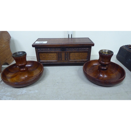 168 - Wooden items: to include carved animals; and a book trough  6